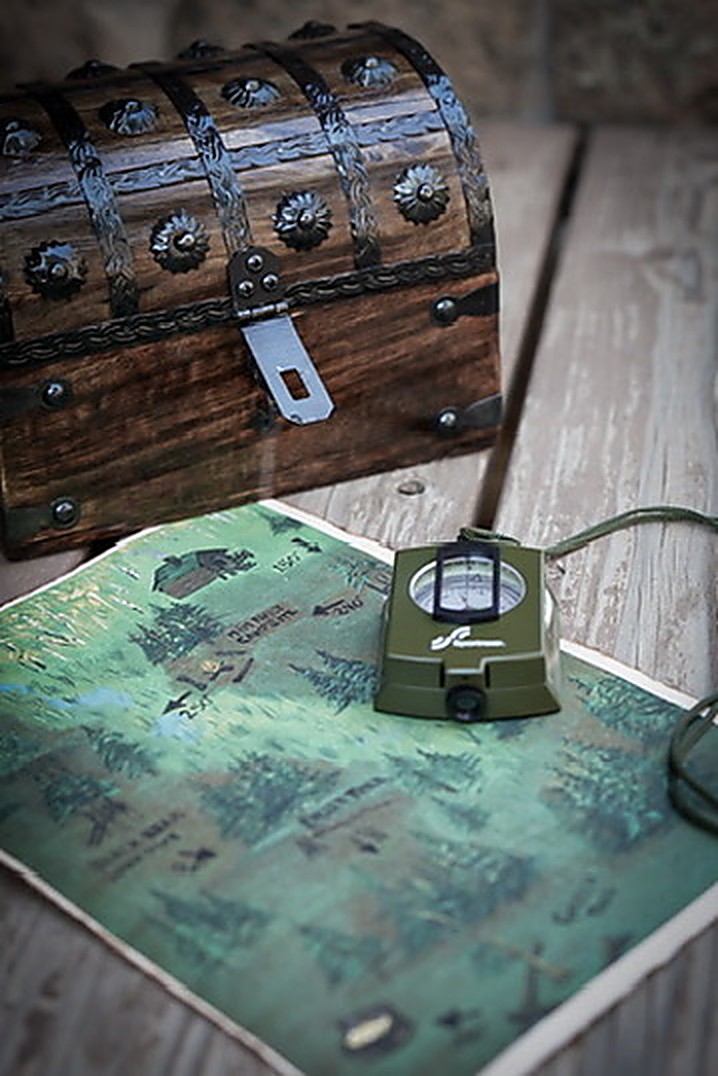 Treasure chest, hand-drawn property map and compass for the forest treasure hunt